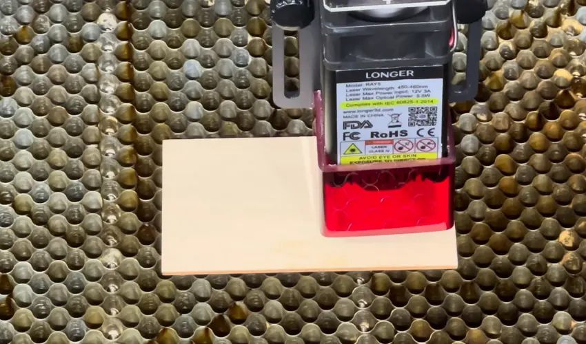 What can the Longer Ray5 5W laser cut through?